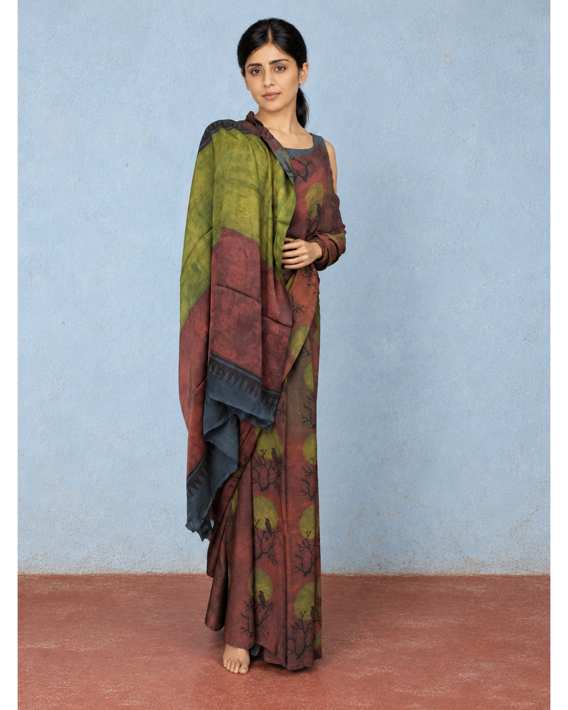Vanraaga rust and olive Tussar–Modal silk saree, draped pallu